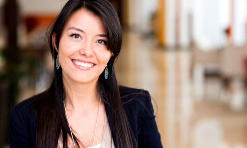 Casual woman looking happy and smiling