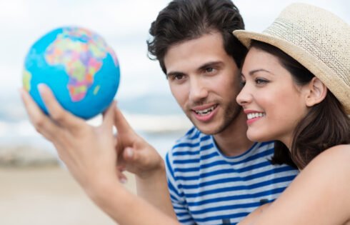 Excited young couple planning their holiday