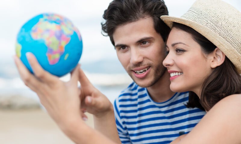 Excited young couple planning their holiday