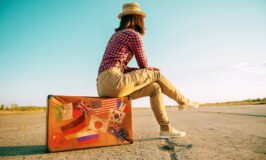 Suitcase with stamps flags