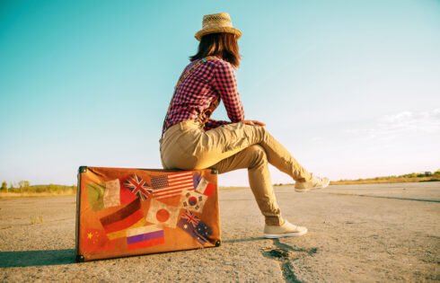 Suitcase with stamps flags